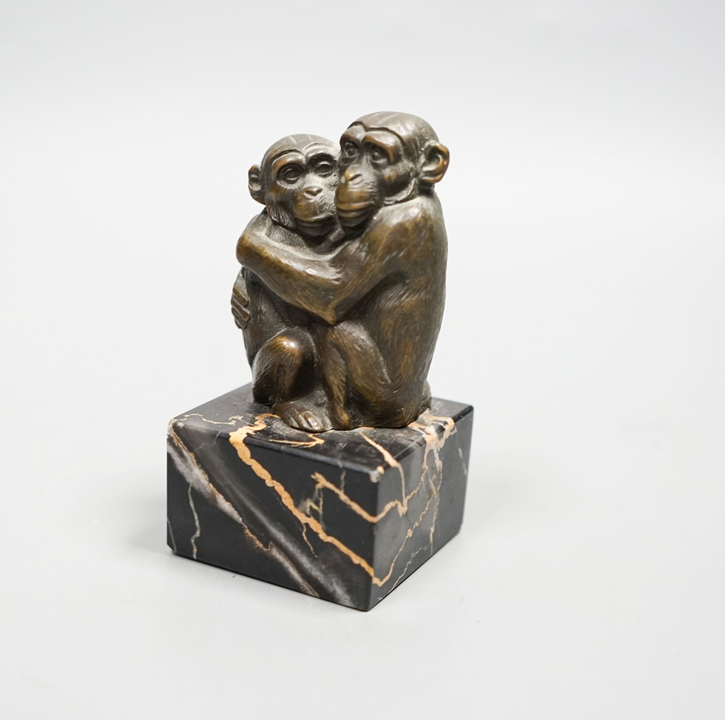 After Barye, bronze, Two monkeys embracing, on square veined black marble plinth, 10cm H 10cm